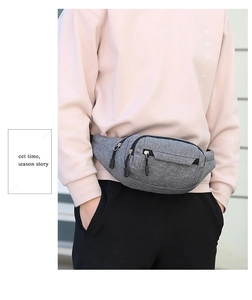 Gray waist bag with heathered texture shown on model for casual outdoor and sport use