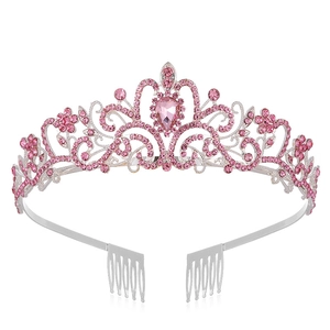 Close-up of pink crystal tiara with silver frame and teardrop gemstone detail