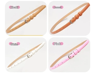 Detail view of four thin leather belts in khaki, camel, white, and pink with silver buckles