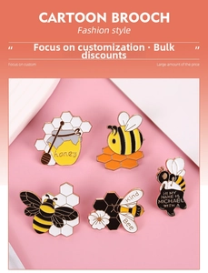 Detail view of colorful cartoon bee enamel pins set with honey jar and floral designs