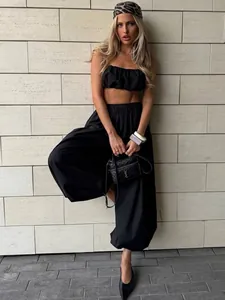 Women's black two-piece cotton set with ruched tube top and baggy wide-leg pants