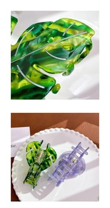 Detailed view of monstera leaf hair claws with marbled green and purple acetate patterns