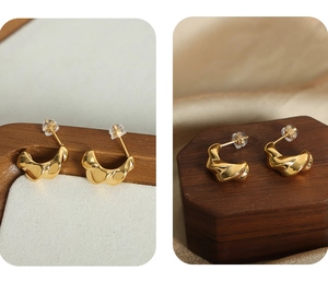 Detailed macro view of gold-plated twisted lava earrings with high polish and silicone back