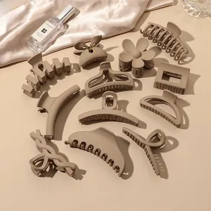 Detail of 11-piece matte milk tea color hair claw set in diverse geometric shapes