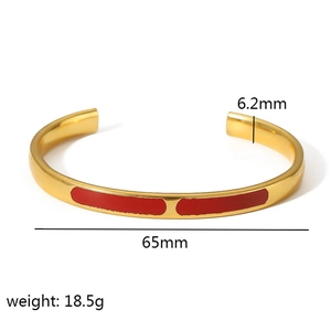 Detail view of 6.2mm gold enamel open bangle with red paint finish and dimension specs
