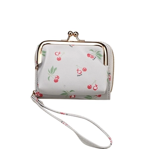 Light gray card wallet with cherry pattern, gold kiss-lock clasp, and matching wrist strap