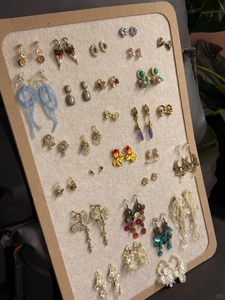 Close-up of bohemian beaded earrings collection with shell and floral tassels