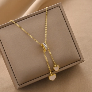 Gold titanium steel tassel heart shell pendant necklace on premium jewelry box display