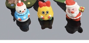 Detailed view of colorful Christmas squishy toys including snowman and Santa Claus