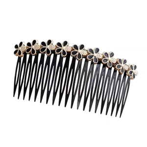 Elegante pettine per capelli con fiori nero e oro per acconciature di classe
