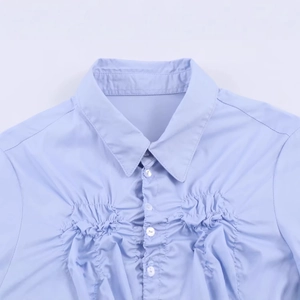 Light blue elastic poplin shirt for women featuring pleated front chest detail
