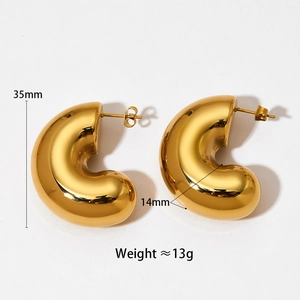 Detail view of chunky gold hollow C-shaped earrings showing 35mm height and mirror finish