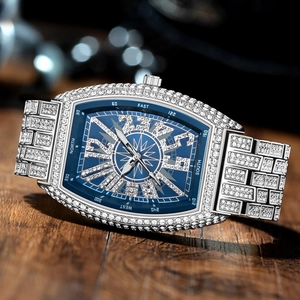 Luxurious silver tonneau watch for men with full diamonds and a blue compass dial