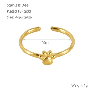Detail of 18k gold plated cat paw open ring showing adjustable band and polished finish