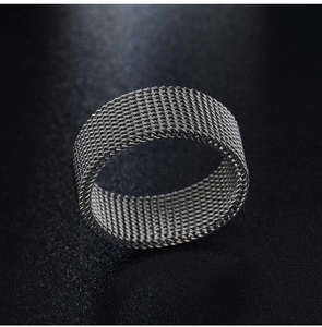 Macro shot of 8mm stainless steel ring featuring a mesh weave texture on black background
