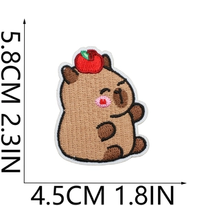 Close-up of Capybara embroidery patch with red apple and 5.8cm size measurements