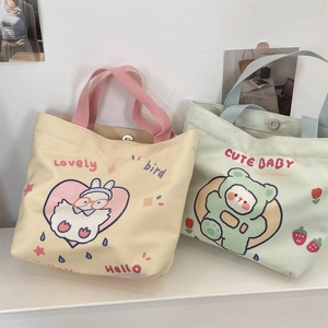Detail of cute rabbit and bear canvas tote bags with secure magnetic metal buckles