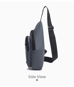 Side view of gray waterproof oxford chest bag with three zipper compartments and strap