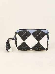 Detail of blue and black diamond knit pattern canvas makeup bag with secure zipper