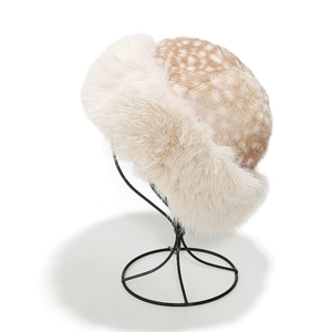 Detail of faux fur winter hat with deer print pattern and fluffy plush brim on a display stand