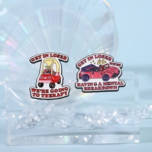 Funny cartoon metal pins featuring figures in cars with witty English therapy quotes