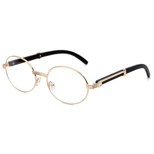 Gafas de sol ovaladas retro de metal dorado con patillas negras sobre fondo blanco