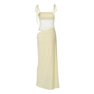 Detail of light yellow lace dress with tie straps and waist cut-out on white background