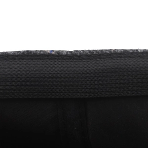Men's winter flat cap interior detail with plaid tweed and elastic comfort band