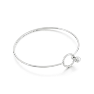 Minimalist silver stainless steel open bangle featuring ring clasp and spherical pendant