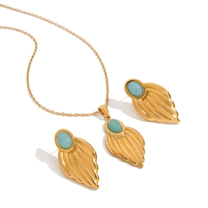 Luxury gold titanium steel jewelry set featuring oval turquoise pendants on white background