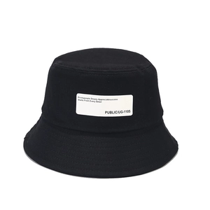 Classic black cotton bucket hat with vintage white patch label for casual outdoor sun protection