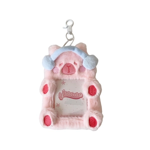 Pink plush cat card holder with blue earmuffs and keychain clip for photo cards