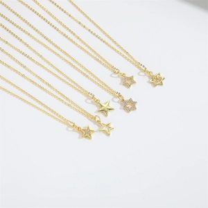 Detailed view of various gold star pendant necklaces with solid and hollow designs