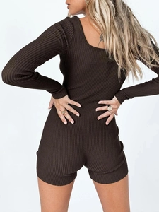 Detail view of deep brown ribbed knit yoga romper with long sleeves and square back design