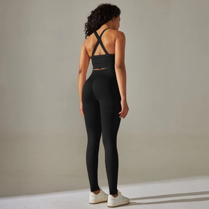 Detail of cross-back sports bra and high-waist seamless leggings in black fitness set