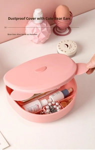 Pink bear-ear storage box detail with compartments for jewelry and skincare samples
