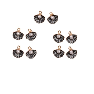 Macro detail of 10 grey shell pendants with gold edges and white pearls for DIY jewelry
