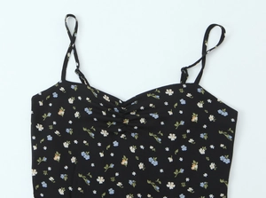 Detail of adjustable straps and ruched neckline on black floral summer camisole top