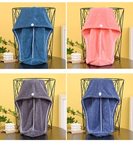 Detailed close-up of thick coral fleece hair drying towels in four soft pastel colors