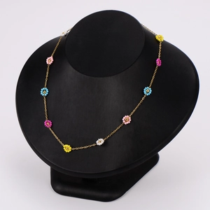 304 stainless steel daisy necklace with colorful bead flowers on a black mannequin display