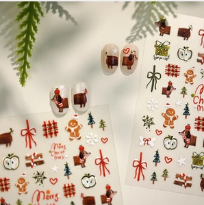 Detailed Christmas nail stickers with dachshund, gingerbread man and festive bow designs