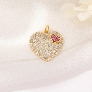Exquisite gold heart pendant with white zircon micro-pave and small red zircon heart detail