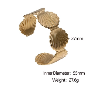 Detailed view of golden scallop bangle showing 27mm width and 55mm inner diameter