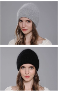 Detailed view of fluffy angora rabbit fur knit beanies in black and light grey colors
