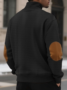 Rear view of black waffle knit sweatshirt with brown elbow patches and stand collar