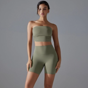 Detailed view of sage green two-piece yoga set with bandeau top and high waist shorts