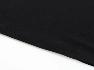 Macro detail of high-quality double-needle stitching on black Tencel wool knit fabric