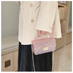 Pink translucent jelly crossbody bag with quilted pattern, bead handle and gold chain