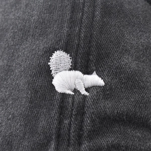 Washed cotton baseball cap featuring detailed squirrel embroidery and vintage twill texture