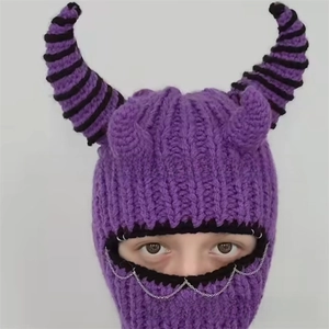 Close-up of purple knit Balaclava with devil horns, metal rings and punk chain details